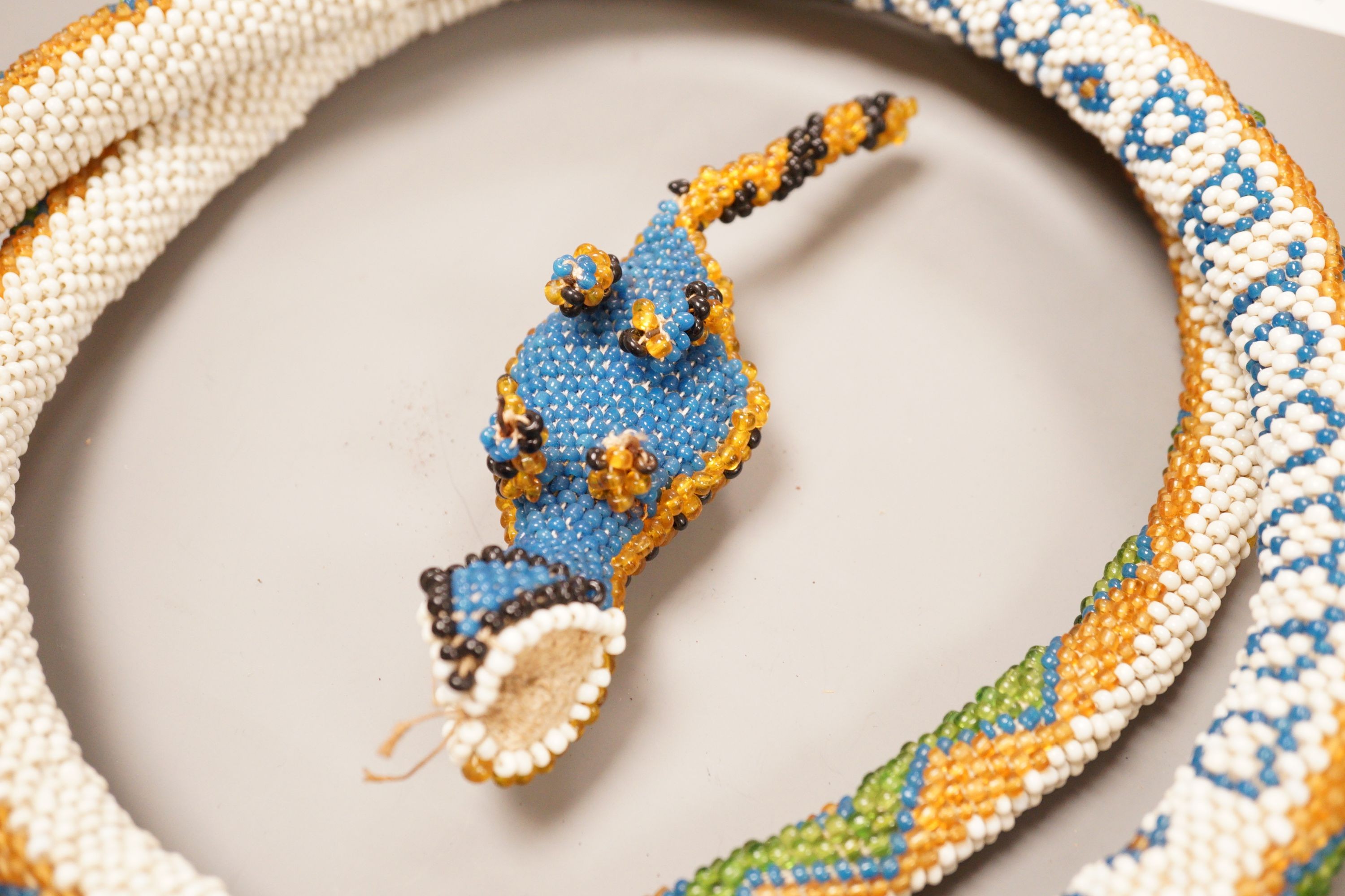 A Turkish Prisoner beadwork model of a snake, and another model